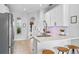 Bright kitchen with stainless appliances, quartz countertops, breakfast bar and tile floors at 820 Timber Isle Dr, Orlando, FL 32828