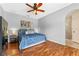 Comfortable main bedroom with wood floors and an ensuite bathroom at 820 Timber Isle Dr, Orlando, FL 32828