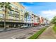 A street view of commercial buildings featuring retail stores and restaurants with awnings and palm trees at 820 Timber Isle Dr, Orlando, FL 32828