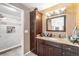 Modern bathroom with large vanity, granite countertops and shower at 85 Carolwood Blvd, Fern Park, FL 32730