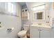 Cozy half bathroom featuring white cabinets and a stylish vanity at 85 Carolwood Blvd, Fern Park, FL 32730