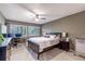Comfortable bedroom with fan, neutral colors, and sunny windows at 85 Carolwood Blvd, Fern Park, FL 32730