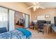 Bright bedroom with sliding glass doors, ceiling fan, and view into the main house at 85 Carolwood Blvd, Fern Park, FL 32730