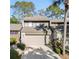 Charming condo with a two-car garage, lush landscaping, and modern architectural details at 85 Carolwood Blvd, Fern Park, FL 32730