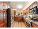 Spacious kitchen with stainless steel appliances, ample cabinet space, and granite countertops at 85 Carolwood Blvd, Fern Park, FL 32730