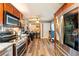 Open kitchen view includes stainless steel appliances, granite counters, and laundry area with washer/dryer at 85 Carolwood Blvd, Fern Park, FL 32730