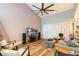 Bright living room with high ceilings, a ceiling fan, and stairs that lead to the upper level at 85 Carolwood Blvd, Fern Park, FL 32730