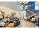 Bright living room with an open layout, a ceiling fan, and stairs that lead to the upper level at 85 Carolwood Blvd, Fern Park, FL 32730