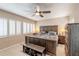 Spacious bedroom with a ceiling fan, plantation shutters and carpet at 85 Carolwood Blvd, Fern Park, FL 32730