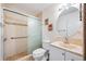 Well-maintained bathroom with tiled walk-in shower and vanity at 870 Darwin Dr, Altamonte Springs, FL 32701