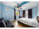 Bedroom features a large window, a comfortable bed and a futon for additional seating at 870 Darwin Dr, Altamonte Springs, FL 32701