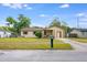 Charming single-story home with a well-maintained lawn, inviting curb appeal, and an attached garage at 870 Darwin Dr, Altamonte Springs, FL 32701