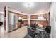Eat in kitchen features stainless steel appliances and wooden cabinets at 870 Darwin Dr, Altamonte Springs, FL 32701