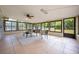 Bright sun room with tile flooring and windows overlooking the backyard at 870 Darwin Dr, Altamonte Springs, FL 32701