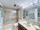 Well-lit bathroom with a shower, vanity, toilet, and a spacious layout at 1 Huntley Ct, Haines City, FL 33844