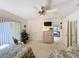 Bedroom with twin beds that features a ceiling fan and a view towards the patio at 1 Huntley Ct, Haines City, FL 33844