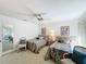 Comfortable bedroom with two twin beds, carpet floor, ceiling fan and a view toward the hall at 1 Huntley Ct, Haines City, FL 33844