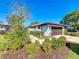 Charming single-story home with mature landscaping, a well-maintained lawn, and a welcoming curb appeal at 1 Huntley Ct, Haines City, FL 33844