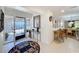 Inviting foyer with decorative rug and bar seating, leading to open living spaces at 1 Huntley Ct, Haines City, FL 33844