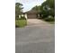 Attached garage with wide driveway and beautiful, mature landscaping at 1 Huntley Ct, Haines City, FL 33844