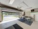 Spacious garage with open door, offering ample room for parking and storage, plus seating and an outside view at 1 Huntley Ct, Haines City, FL 33844
