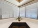 Kitchen sink with decorative faucet in front of a bright window with white blinds and view to the outside at 1 Huntley Ct, Haines City, FL 33844