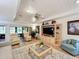 Bright living room featuring neutral tones, a ceiling fan and access to the lanai at 1 Huntley Ct, Haines City, FL 33844