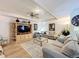 Comfortable living room featuring stylish furniture and a built-in entertainment center at 1 Huntley Ct, Haines City, FL 33844