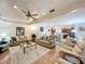 Spacious living room with hardwood floors, ceiling fan and an open floor plan at 1 Huntley Ct, Haines City, FL 33844