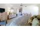 Main bedroom with ceiling fan and carpet floor that includes furnishings and a view towards the bathroom at 1 Huntley Ct, Haines City, FL 33844