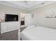 Bright bedroom with a view into a bathroom at 10765 Village Lake Rd, Windermere, FL 34786