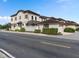 Well-maintained townhome exterior featuring an attached garage, and privacy fence at 10765 Village Lake Rd, Windermere, FL 34786