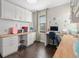 Well-organized office features custom built-ins, wood countertops, and natural lighting at 10765 Village Lake Rd, Windermere, FL 34786