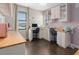 Bright office space with custom cabinets, wood countertops, and stylish floral wallpaper at 10765 Village Lake Rd, Windermere, FL 34786