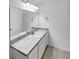 Bright bathroom vanity with an oval sink and modern light fixture above the large mirror at 1112 Merrill St, Davenport, FL 33837