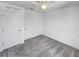Bright bedroom with ceiling fan and two closets, providing ample storage space at 1112 Merrill St, Davenport, FL 33837