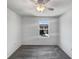 Cozy bedroom with a ceiling fan and a view of the neighborhood at 1112 Merrill St, Davenport, FL 33837