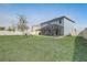 View of the home's backyard that features a covered patio, screened patio, and playset at 11279 Amber Ridge Dr, Zellwood, FL 32798
