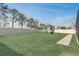 A well-maintained backyard with a playset and ample green space, perfect for outdoor activities at 11279 Amber Ridge Dr, Zellwood, FL 32798