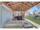 View of backyard with covered patio and outdoor kitchen area with a play set at 11279 Amber Ridge Dr, Zellwood, FL 32798