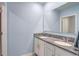 Elegant bathroom with double vanity, granite countertops and modern fixtures at 11279 Amber Ridge Dr, Zellwood, FL 32798