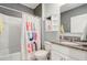 Bathroom with a tub and shower combo and granite countertops at 11279 Amber Ridge Dr, Zellwood, FL 32798