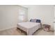 Bedroom with carpet floors and a large window at 11279 Amber Ridge Dr, Zellwood, FL 32798