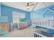 Bright bedroom features a ceiling fan, and modern furniture, creating a cozy atmosphere at 11279 Amber Ridge Dr, Zellwood, FL 32798