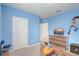 Bright blue bedroom with ample closet space, perfect for storage at 11279 Amber Ridge Dr, Zellwood, FL 32798