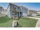Beautiful two-story home featuring a well-manicured lawn, two car garage, and delightful exterior at 11279 Amber Ridge Dr, Zellwood, FL 32798