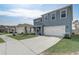 Charming two-story home featuring a two car garage, delightful exterior, and well-maintained lawn at 11279 Amber Ridge Dr, Zellwood, FL 32798