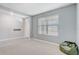 Bright flex room featuring carpet, and a window overlooking the front yard at 11279 Amber Ridge Dr, Zellwood, FL 32798