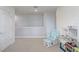 Cozy loft area featuring a comfortable chair, perfect for reading and relaxation at 11279 Amber Ridge Dr, Zellwood, FL 32798