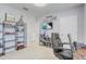 Bright office space featuring stylish shelving units, neutral walls, carpet and lots of light at 11279 Amber Ridge Dr, Zellwood, FL 32798